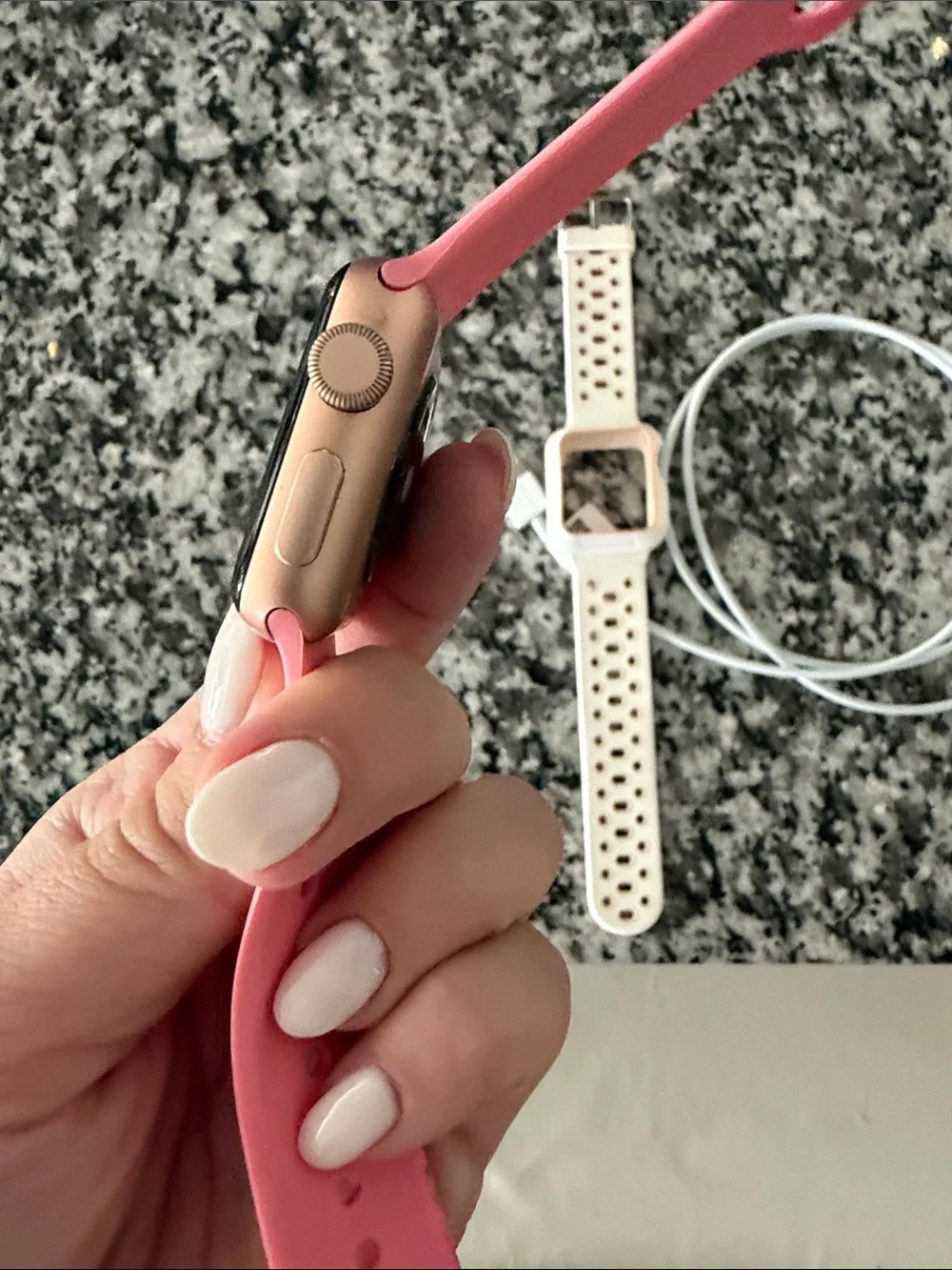 Apple Watch Series 3 with Pink Silicone Band and White Perforated Band